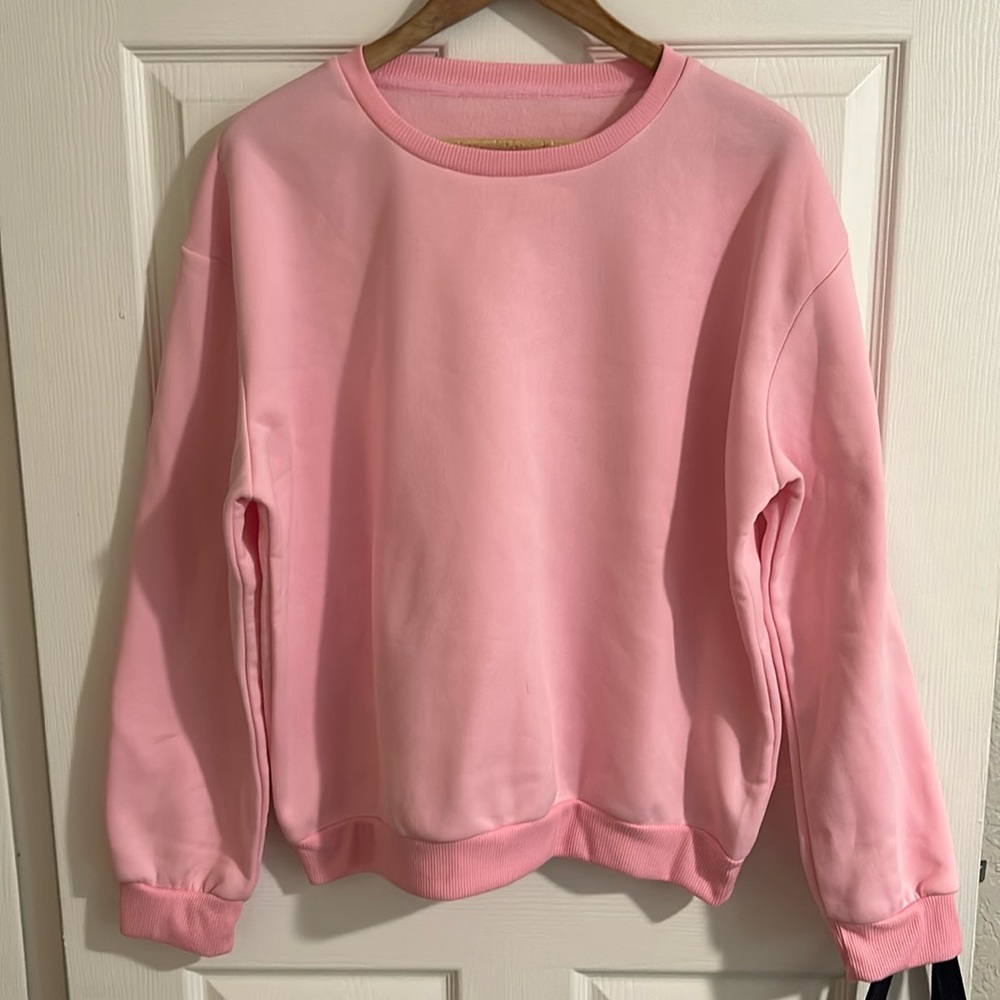 Pink pullover crewneck sweater.